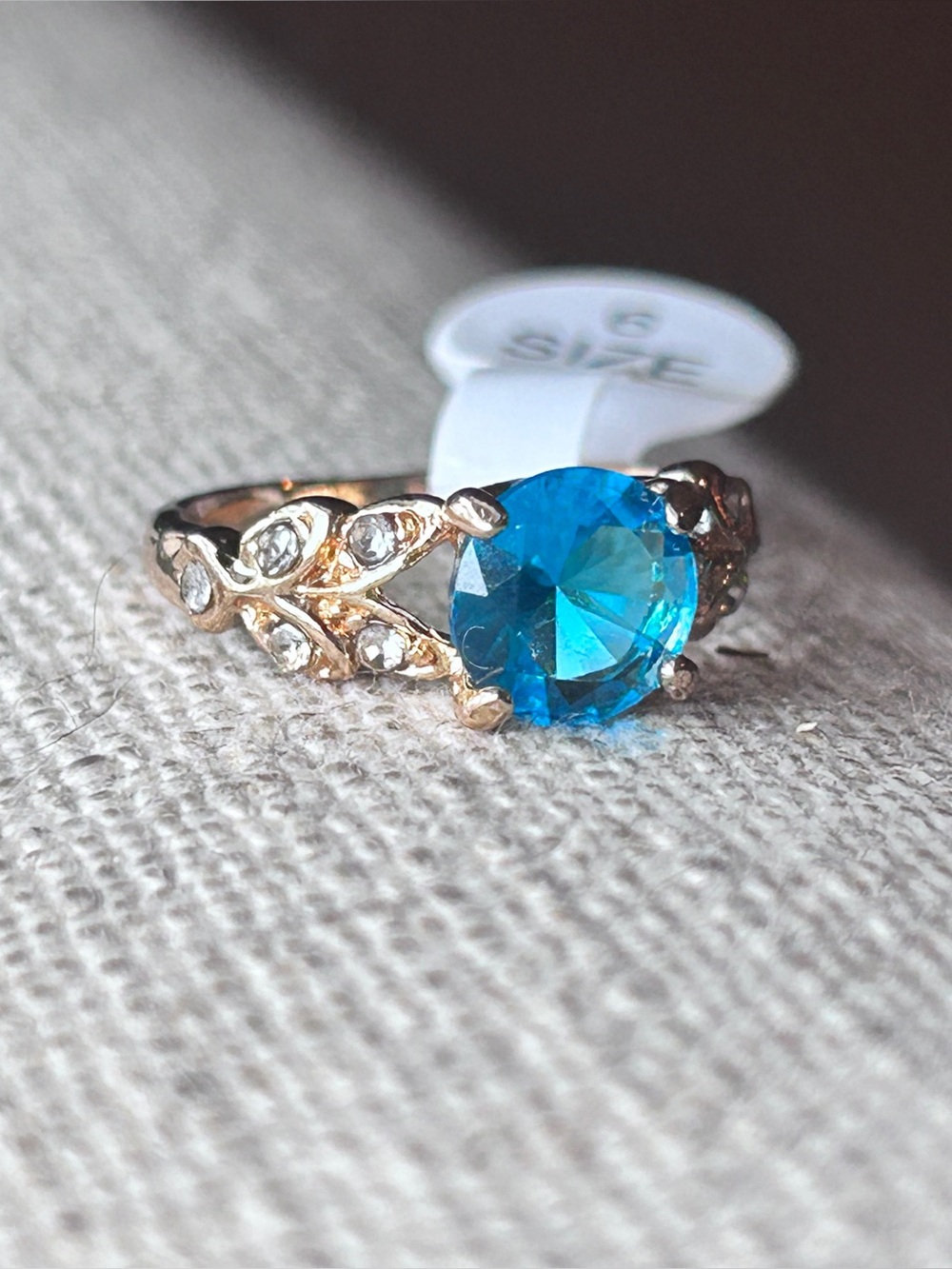 Blue Crystal Halo Ring with Leaf Accents - size 6 .
